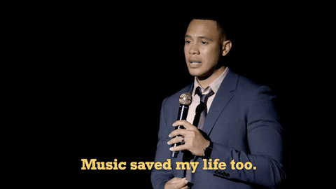 Man with a mic saying 'Music saved my life too.'